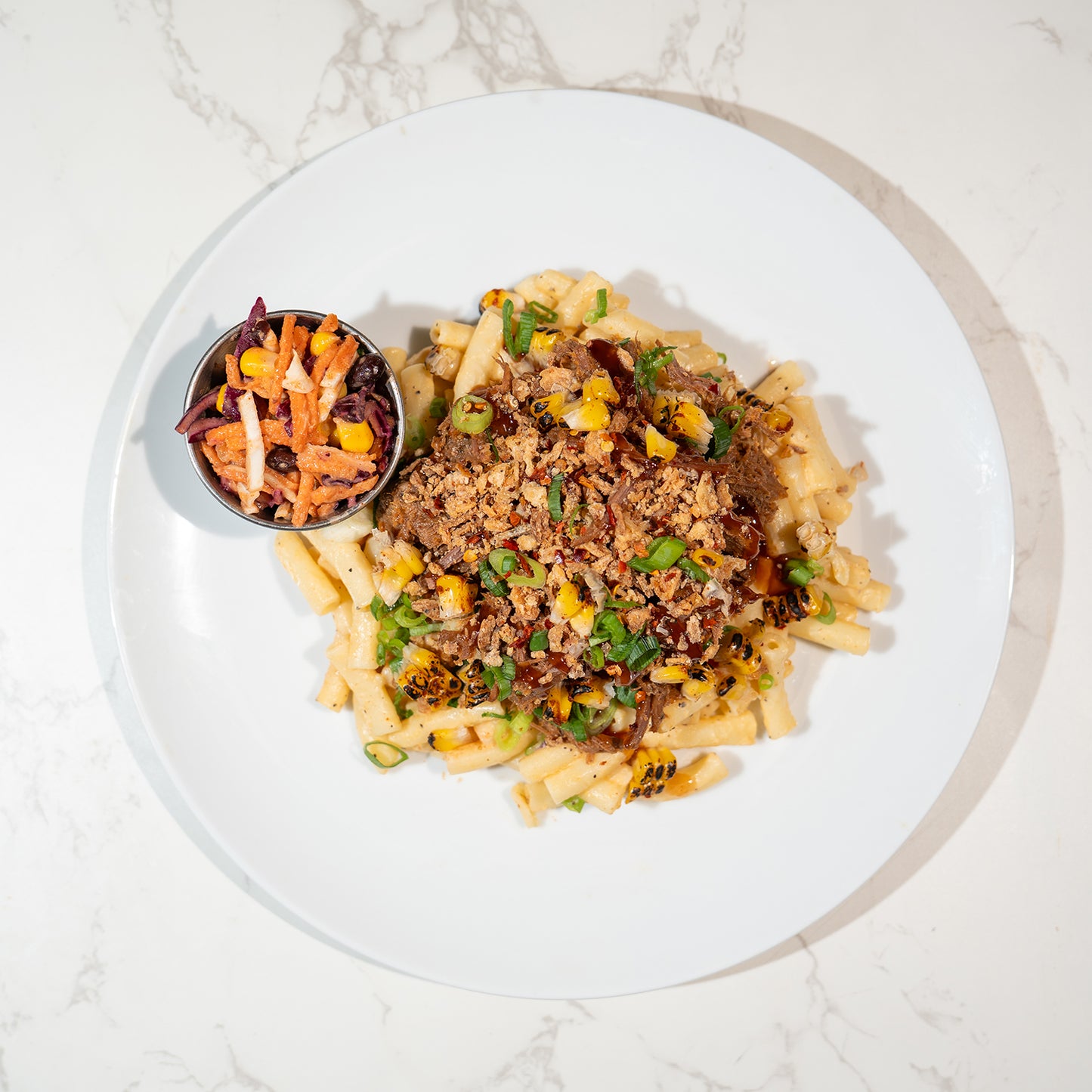 Hickory BBQ Pulled Brisket, 3 Cheese Macaroni, Cowboy Slaw & Crispy Onion