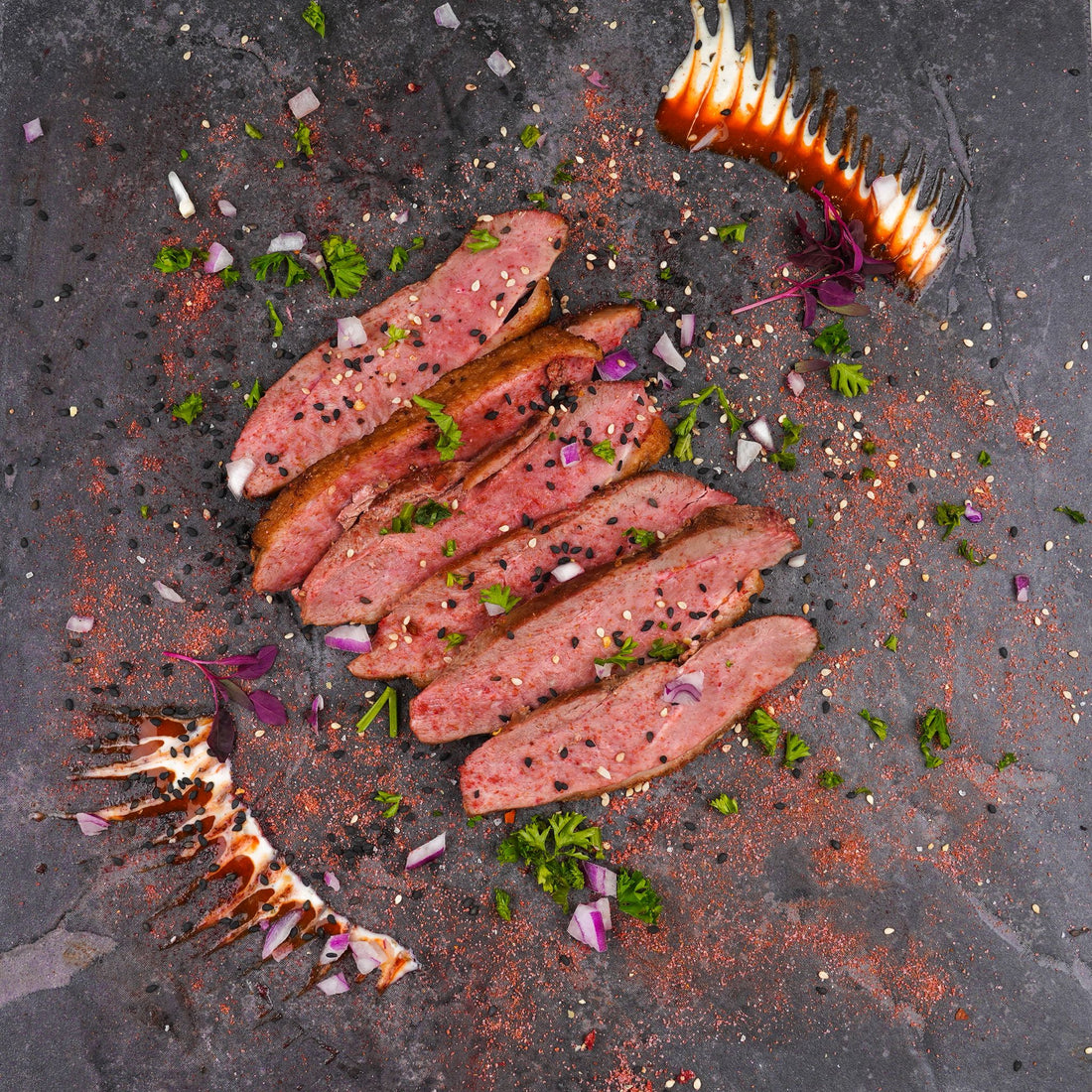 Slices of succulent, high-protein, low-carb duck breast plated with fresh herbs and spices, crafted by Bozu for weight and fat loss in Kingston Upon Thames