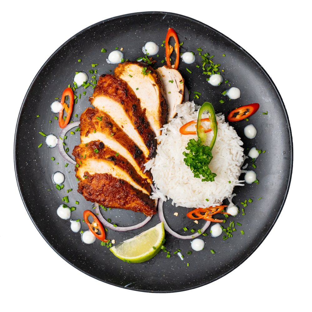 High-protein halal chicken and rice on a plate. Healthy halal meal option in Leicester for balanced nutrition.
