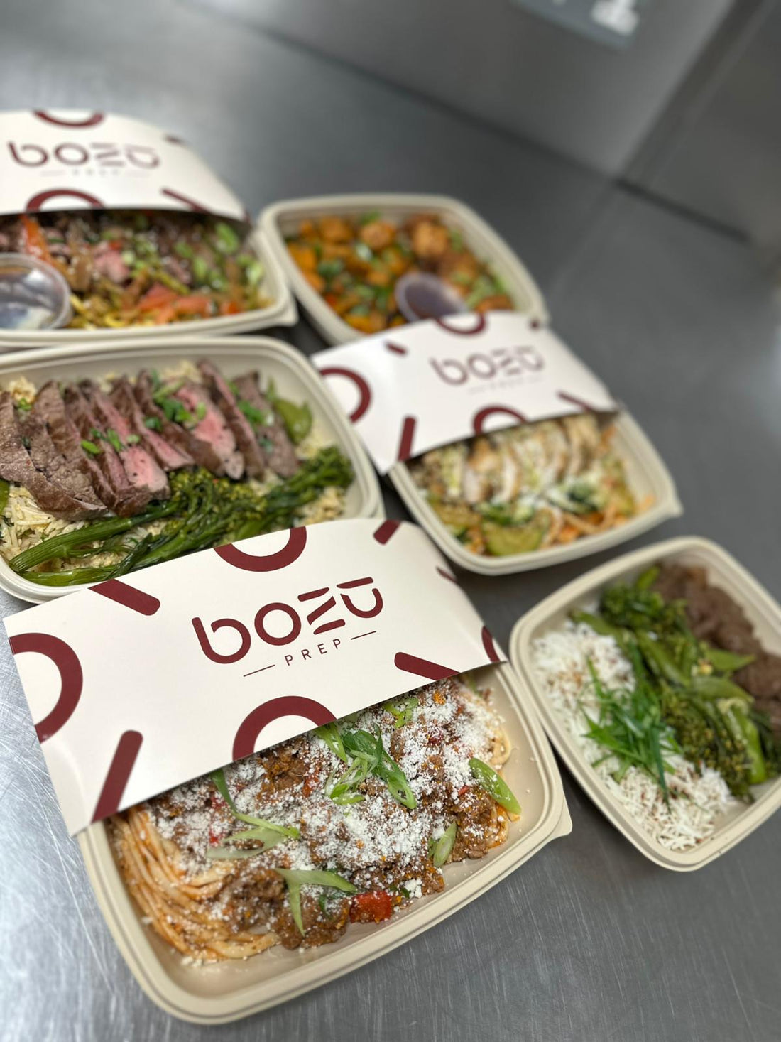 Selection of premium BOZU healthy meal prep meals for students, nutritious high protein meals designed to support weight loss, energy and better eating habits.