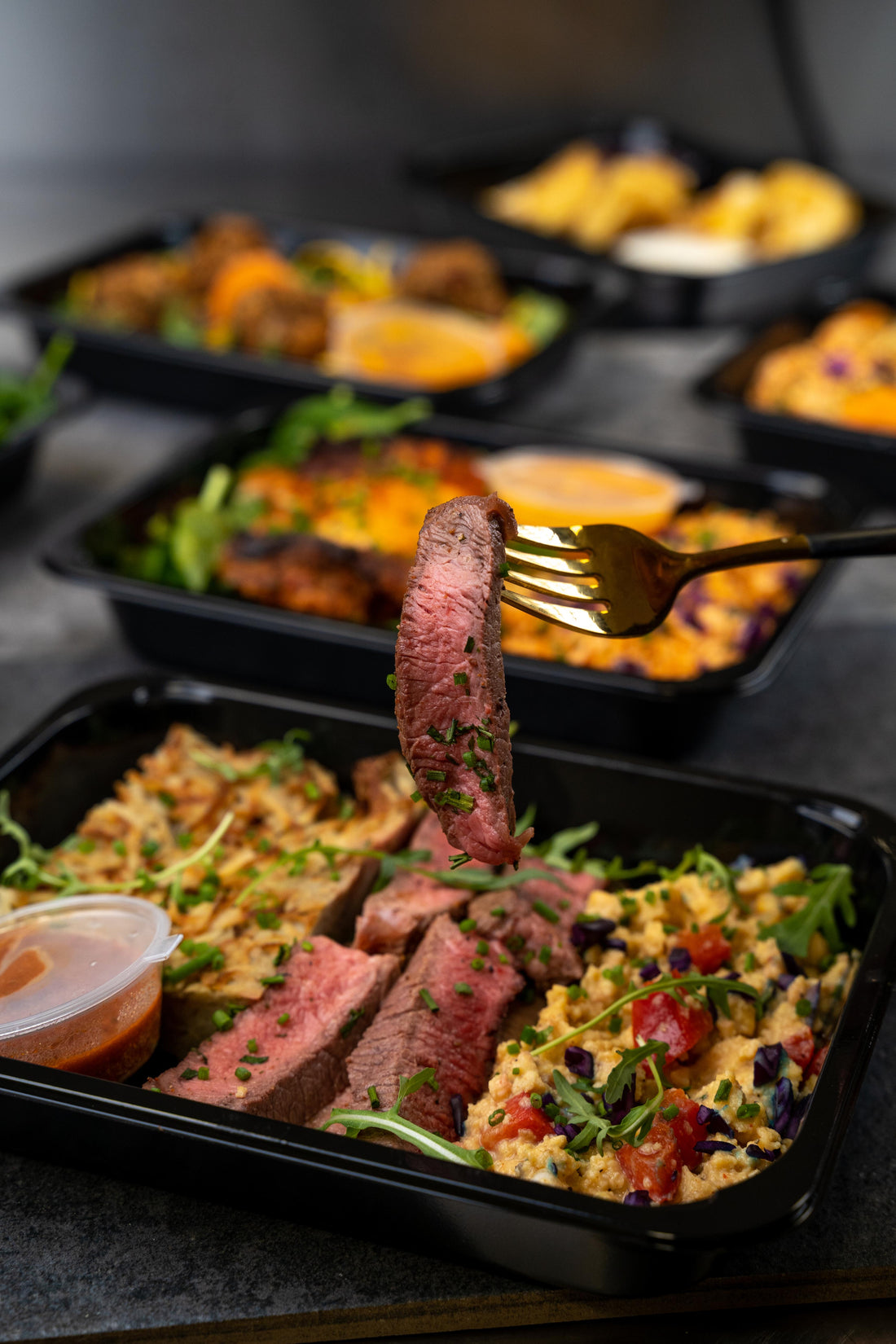 High protein fillet steak meal prep with creamy mashed potato, scrambled eggs, fresh salad and sauce – healthy ready meals delivered in the UK for new parents.