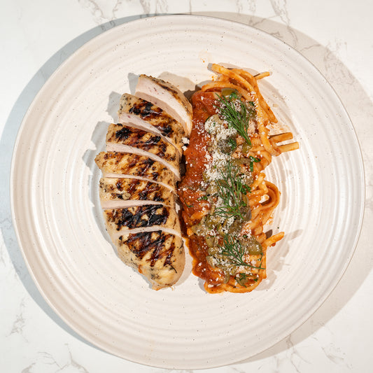 Garlic chicken with puttanesca linguine and parmesan cheese – high protein healthy pasta meal prep by Bozu UK