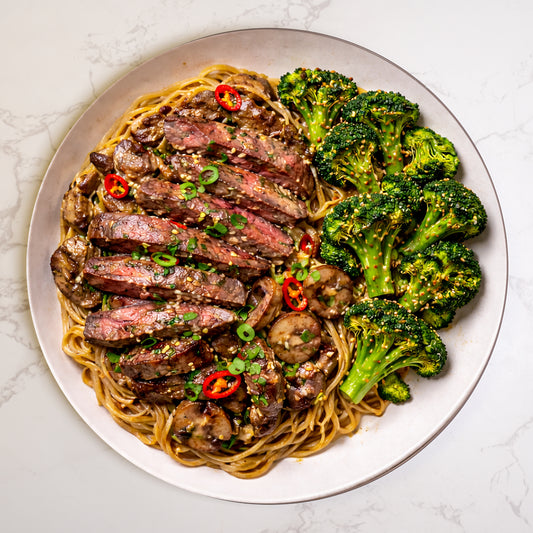 Lao steak noodles with tender beef, stir fried noodles and vegetables – high protein Asian meal prep delivery UK
