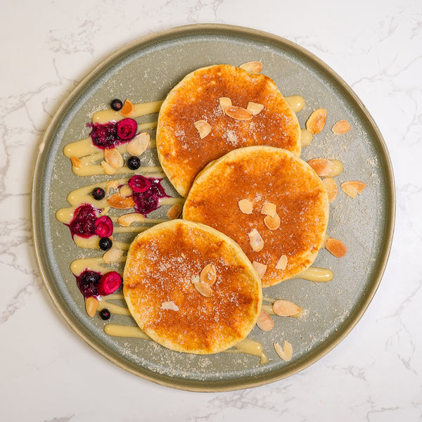 Protein Pancakes, Berry Compote, White Chocolate, Toasted Almonds