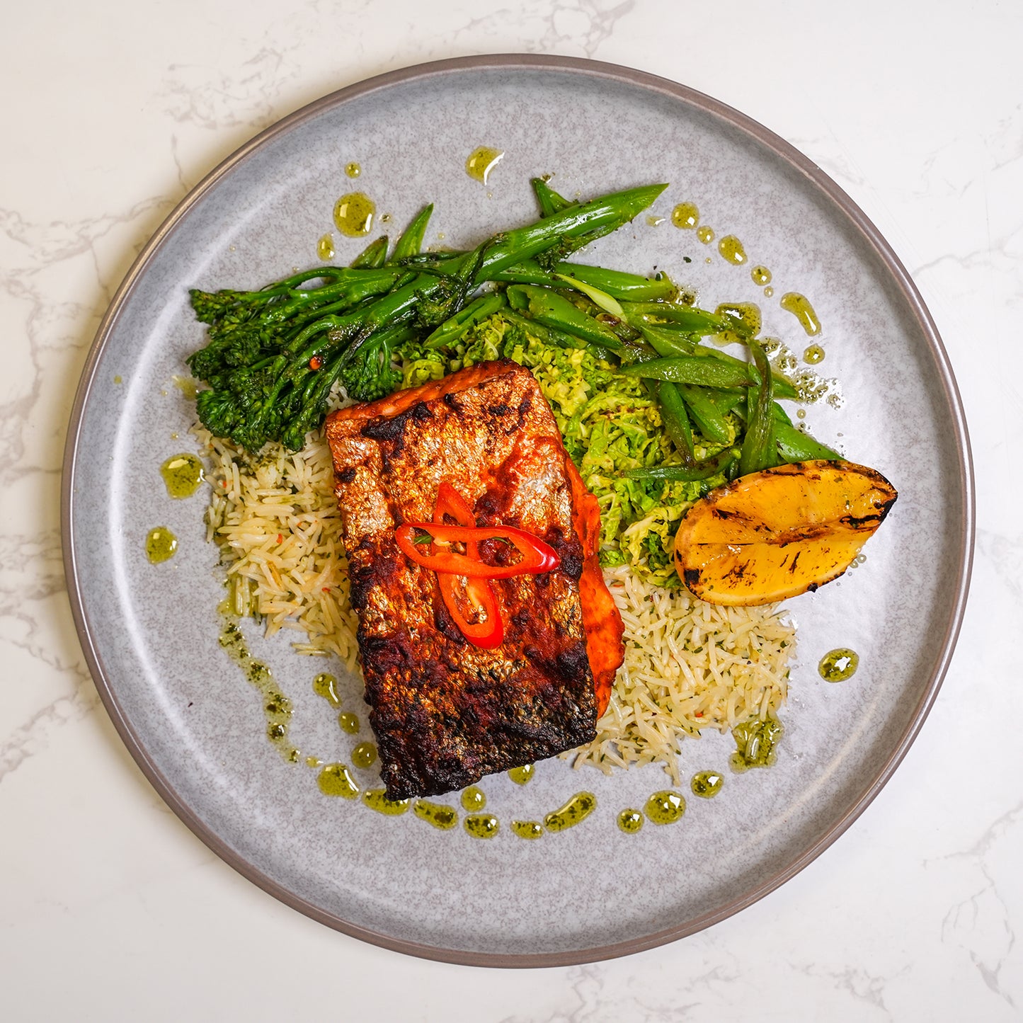 Harissa & Lemon Spiced Salmon, Spiced Rice, Fried Greens, Tzatziki