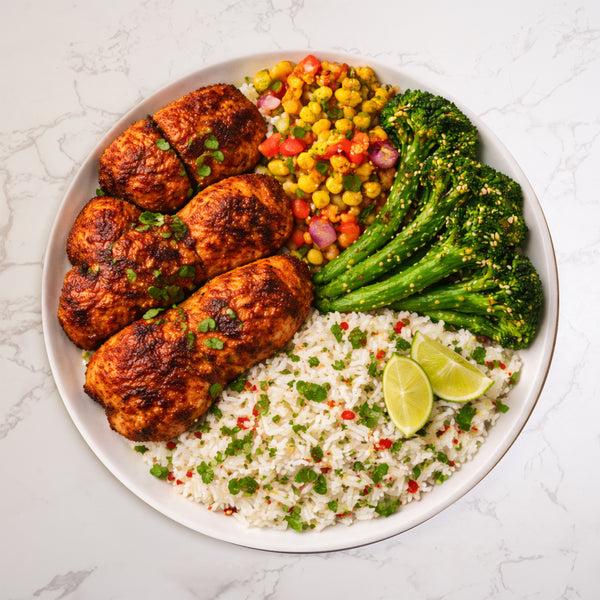 Spicy Harissa Thighs, Coriander Rice, Charred Corn Salsa, Tenderstem