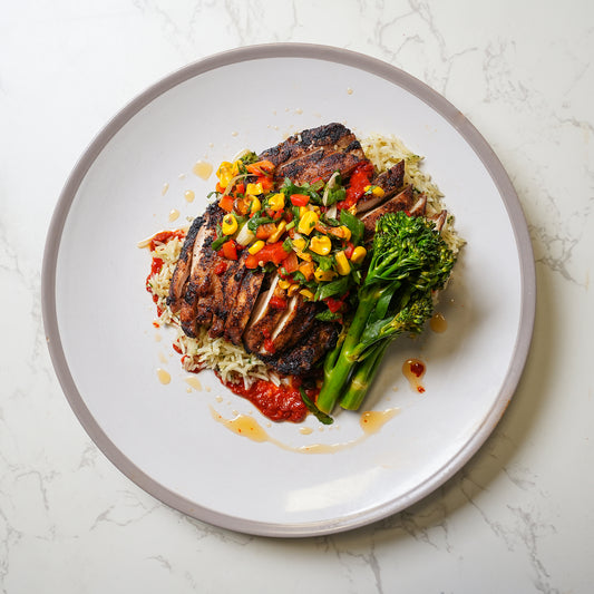 Spicy harissa chicken with rice, corn salsa and broccoli – high protein healthy meal prep UK delivery